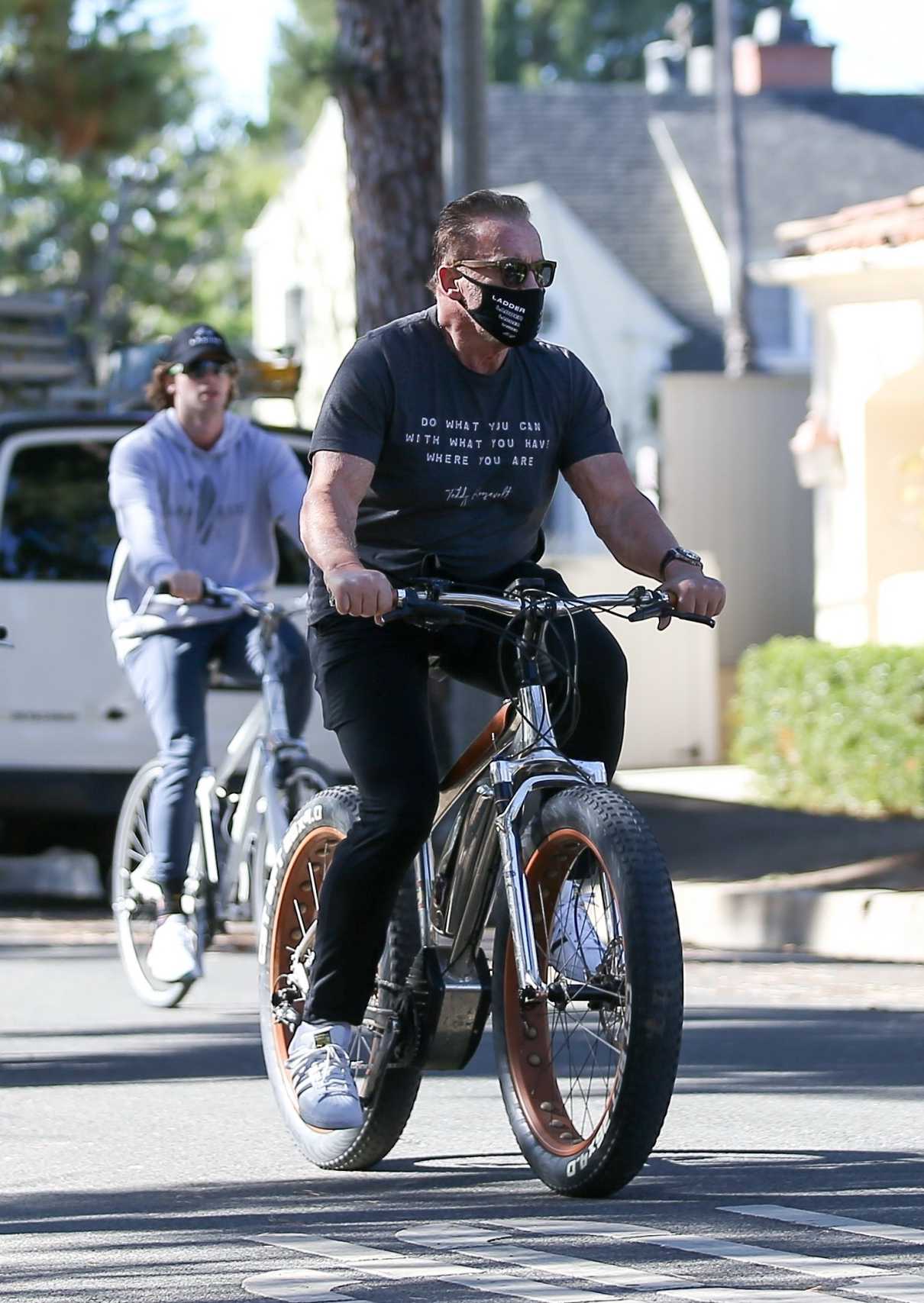 Arnold Schwarzenegger in a Black Tee