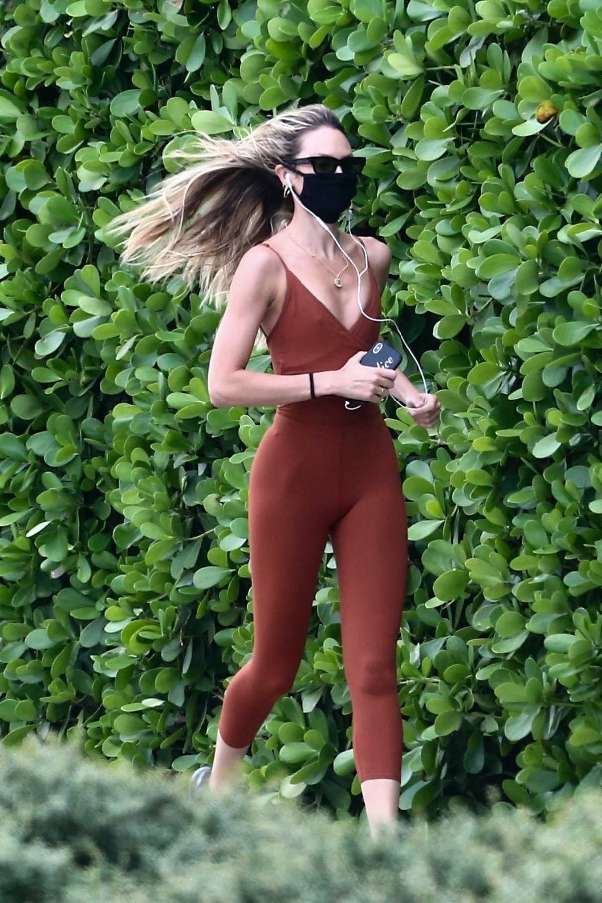 Candice Swanepoel in a Black Protective Mask