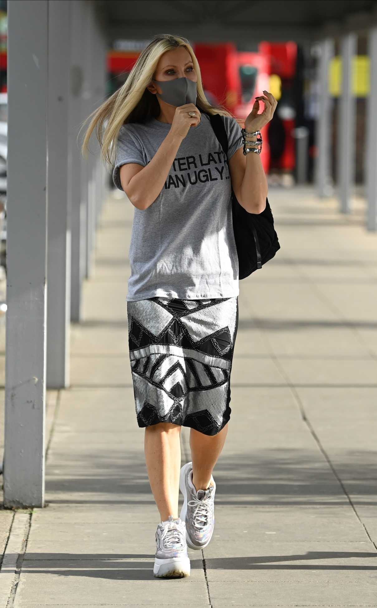 Caprice Bourret in a Gray Tee