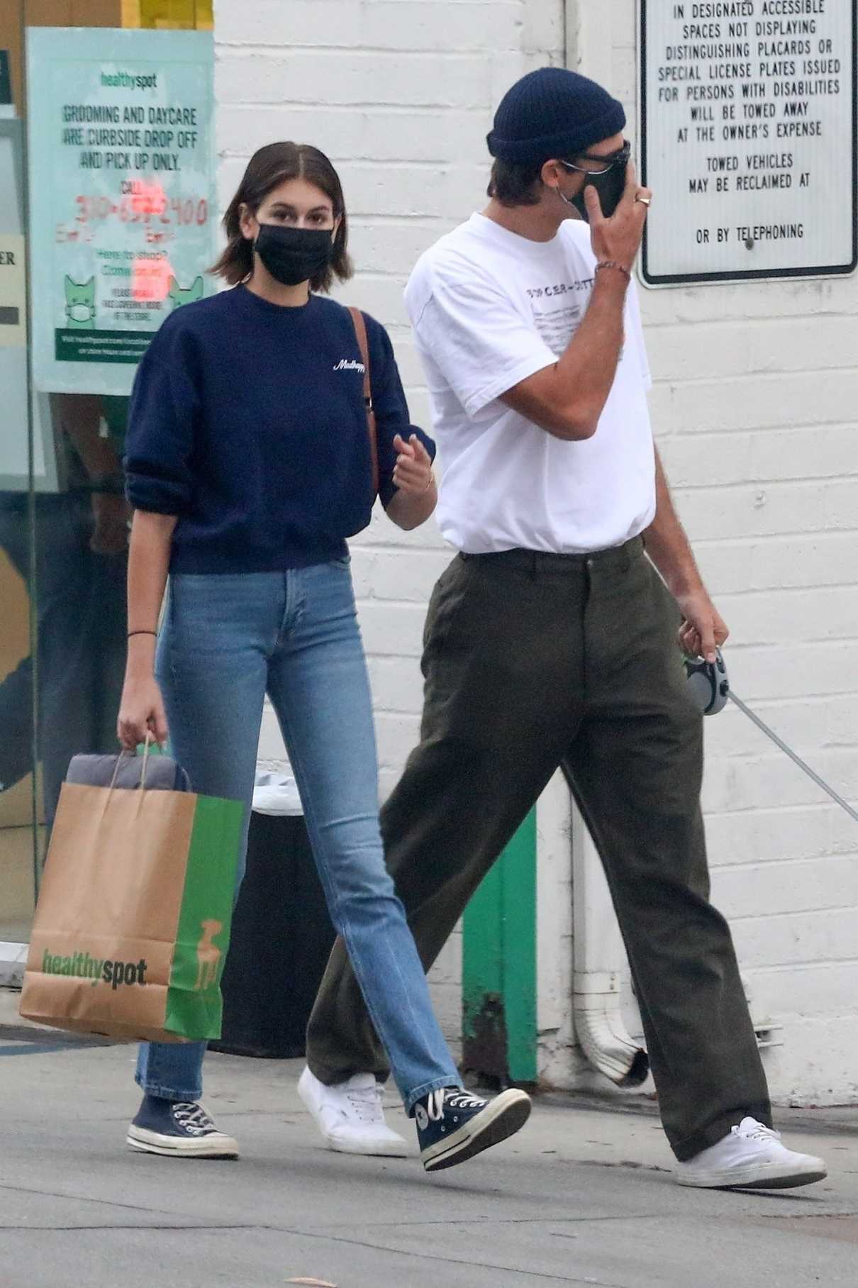 Kaia Gerber in a Black Protective Mask