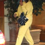 Mindy Kaling in a Yellow Sweatsuit Heads to Her Car in West Hollywood 11/05/2020