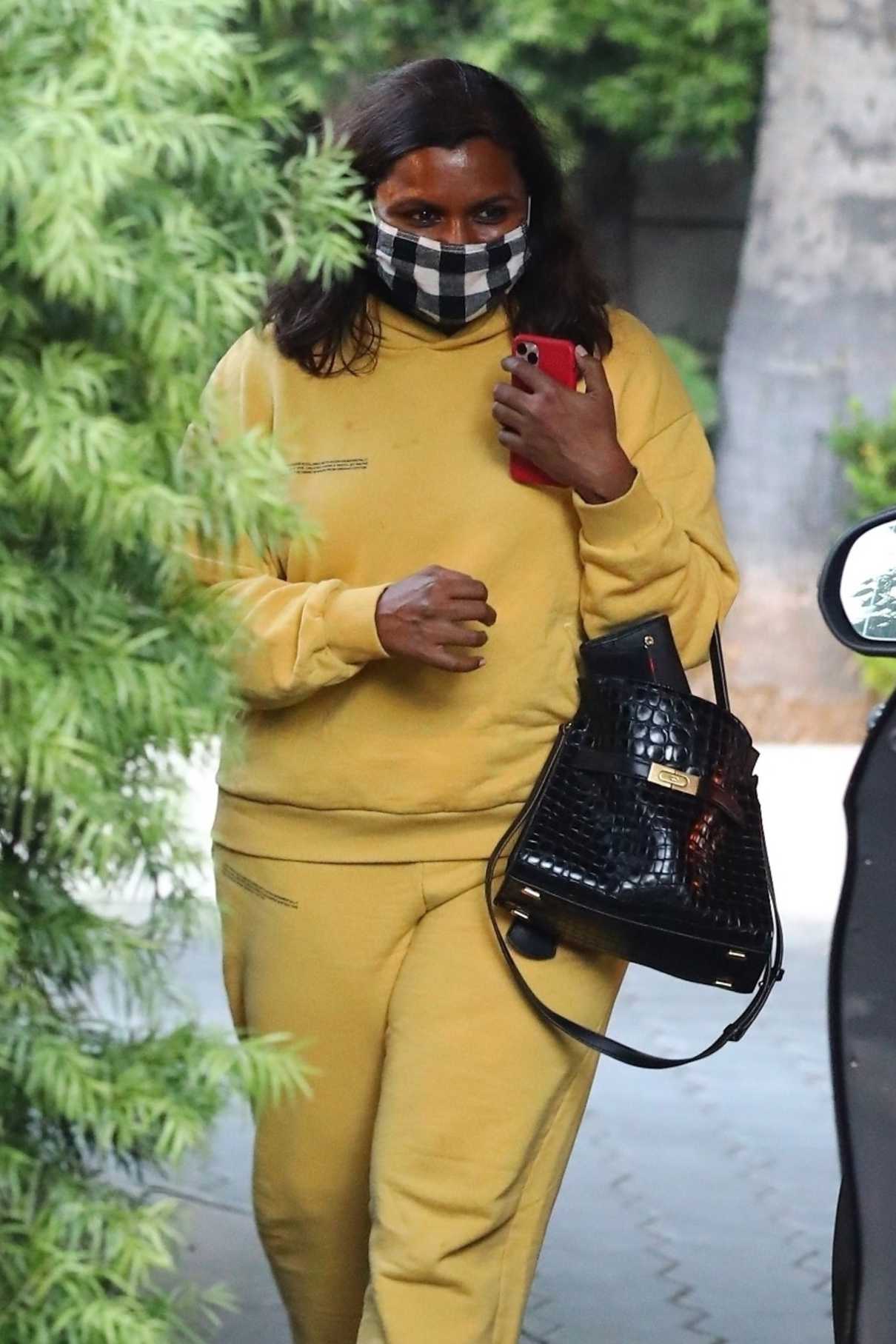 Mindy Kaling in a Yellow Sweatsuit Heads to Her Car in West Hollywood ...