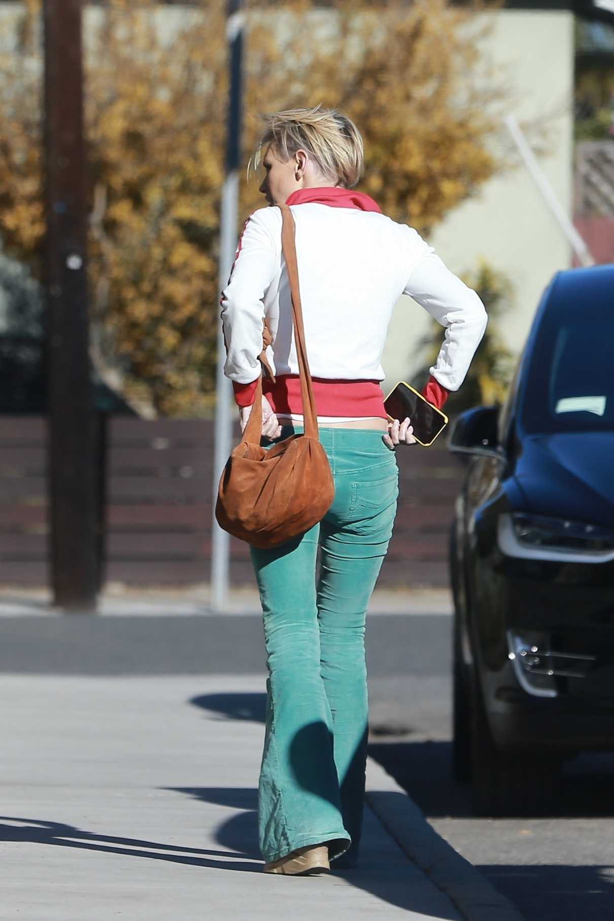 Nicky Whelan in a Green Pants