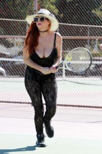 Phoebe Price in a Black Lacy Bodysuit