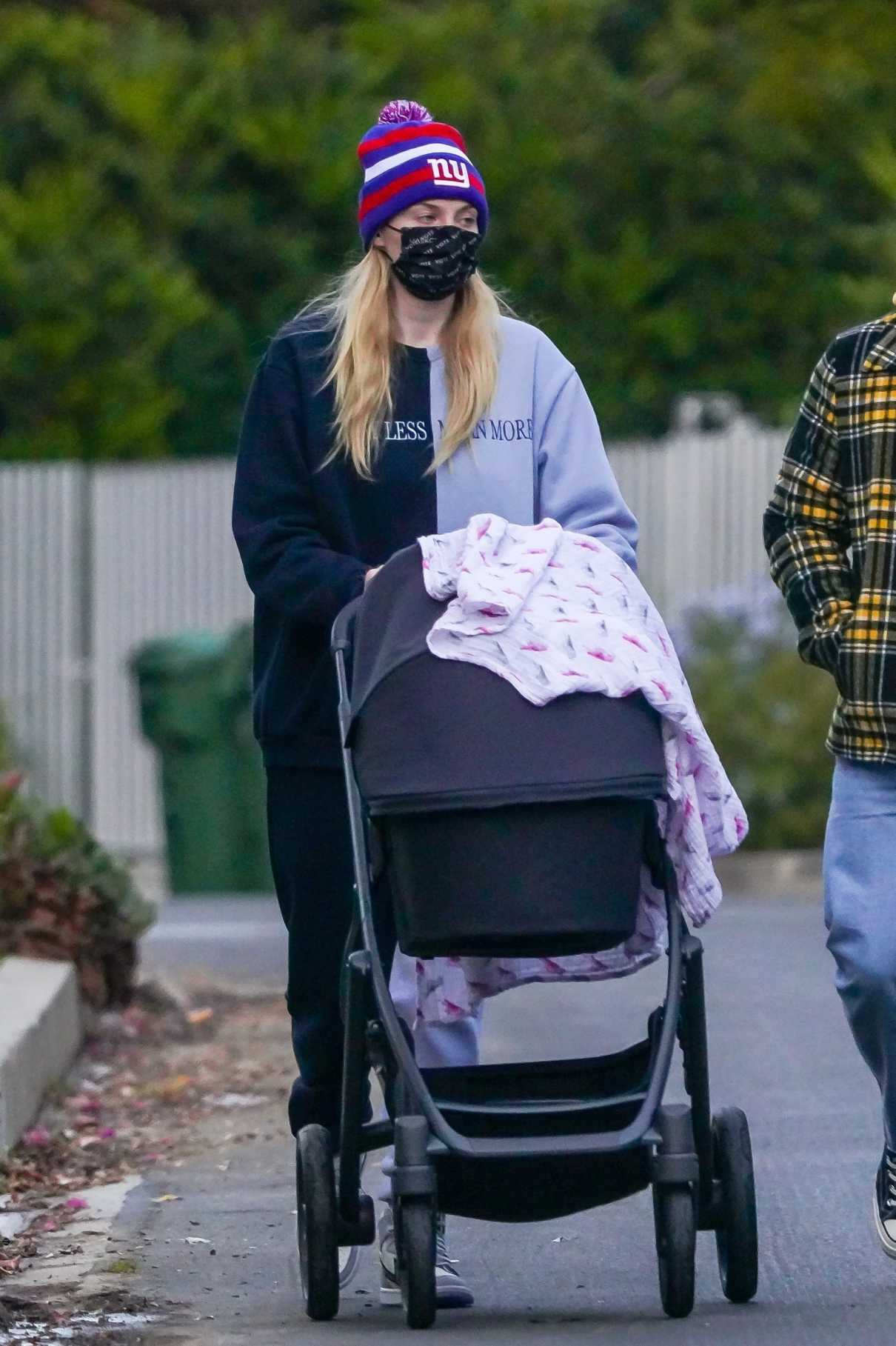 Sophie Turner in a Black Protective Mask