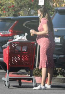 April Love Geary in a Red Polka Dot Dress