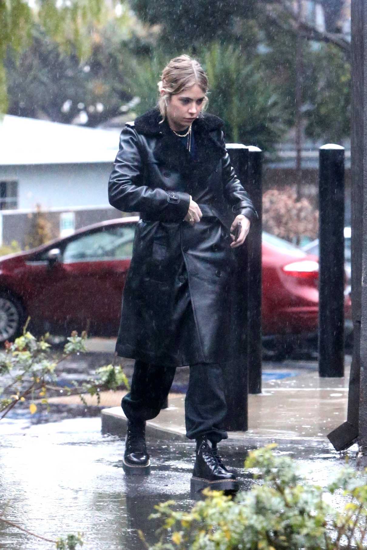 Ashley Benson in a Black Leather Coat