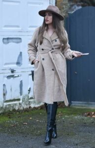 Chloe Ross in a Beige Coat