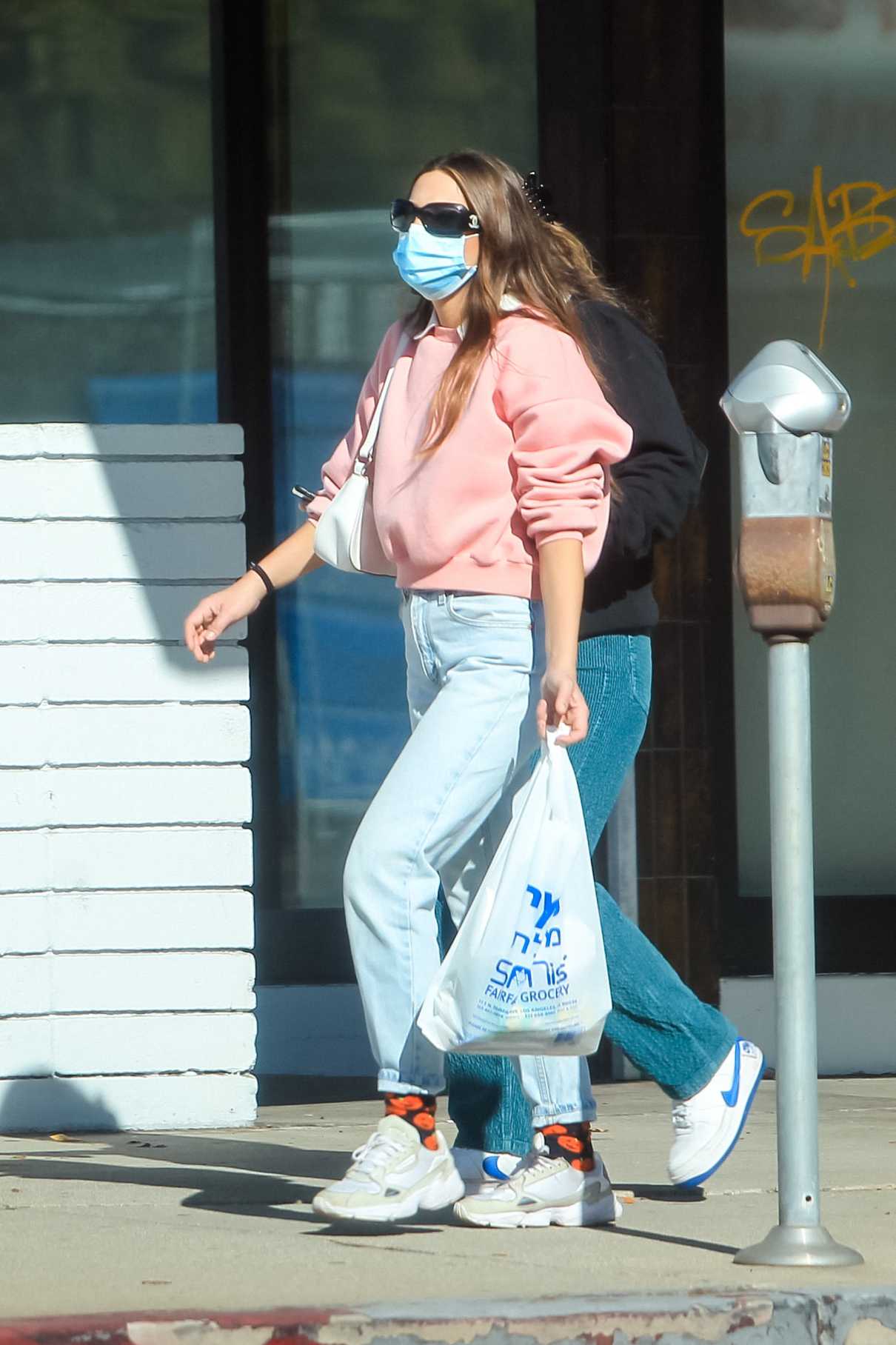 India Eisley in a Pink Sweatshirt