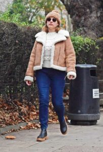 Kelly Brook in a Beige Knit Hat