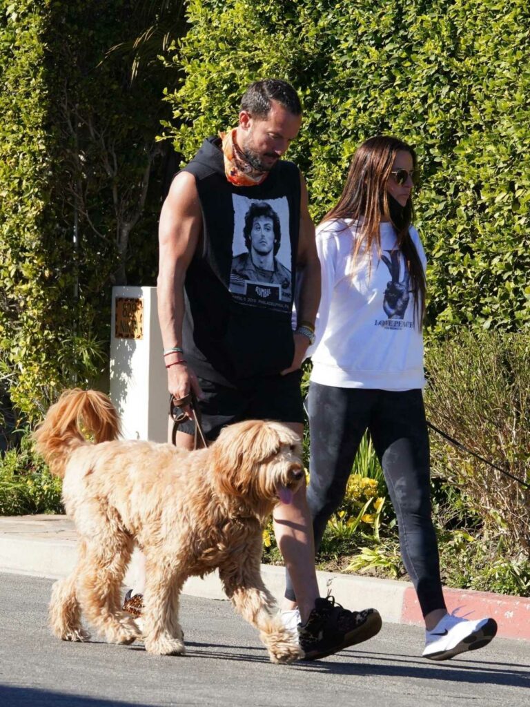 Laura Lentz in a White Sweatshirt Out with Her Husband Walks Her Dogs