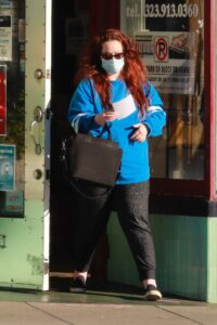 Lily Kershaw in a Blue Sweatshirt