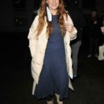 Lucie Jones in a Beige Puffer Coat Arrives at the Press Night for A Christmas Carol at the Dominion Theatre in London 12/14/2020