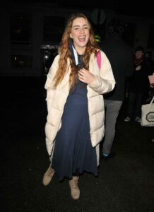 Lucie Jones in a Beige Puffer Coat