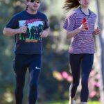 Margaret Qualley in a Striped T-Shirt Heads Out for a Jog with Shia LaBeouf in Pasadena 12/20/2020