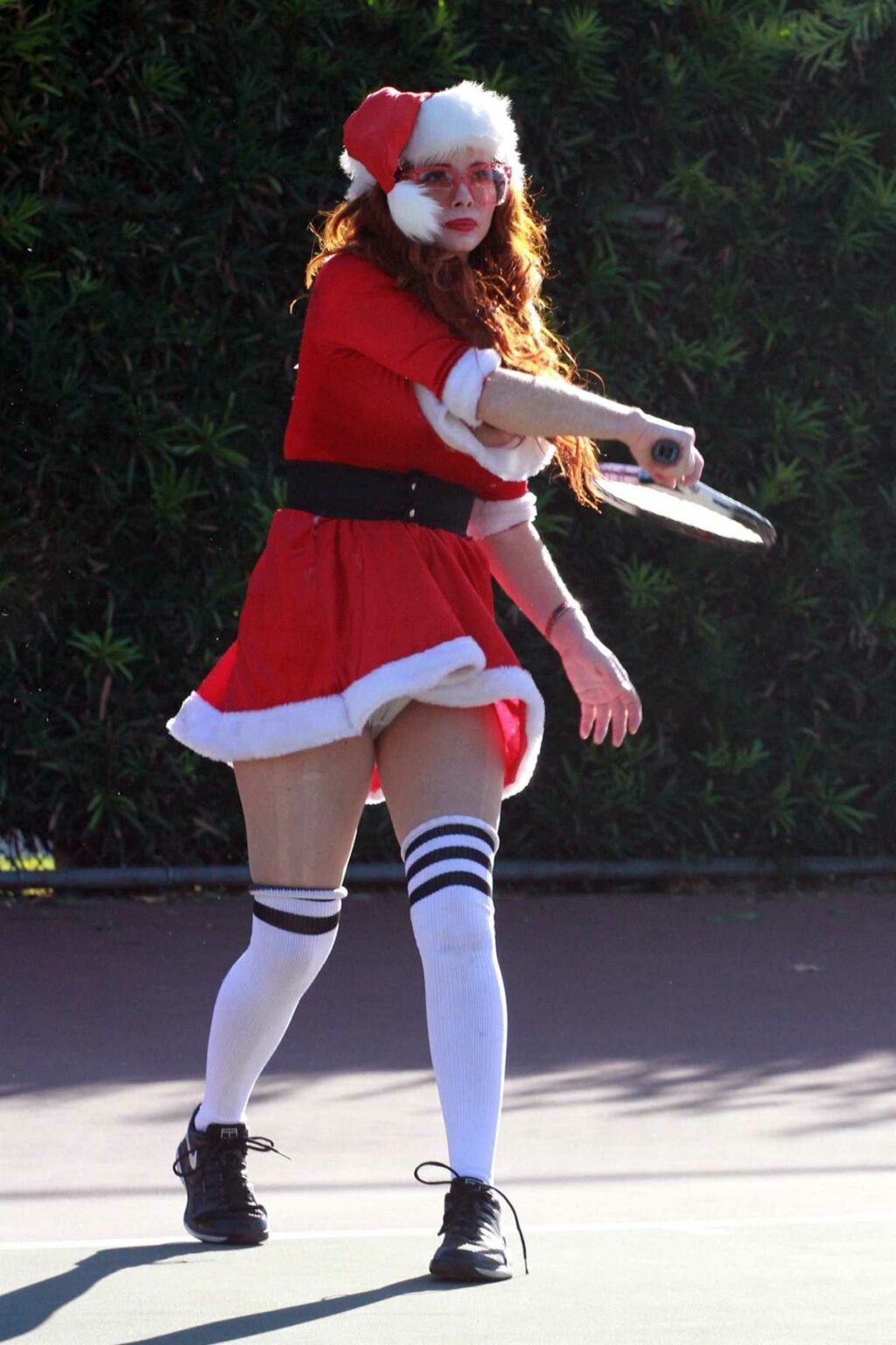 Phoebe Price in a Mrs. Claus Outfit Arrives at the Tennis Courts in Los