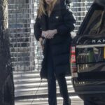 Abbey Clancy in a Black Puffer Coat Drives for Flowers in London 01/24/2021