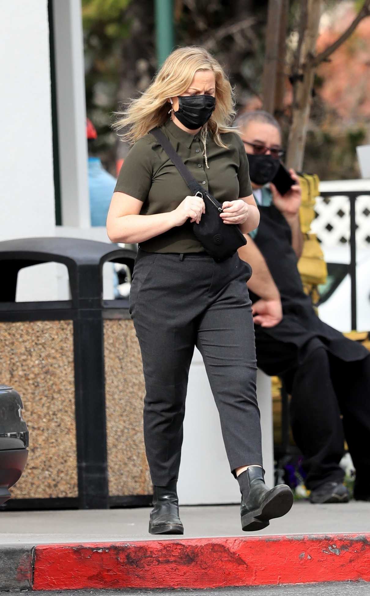 Amy Poehler in a Black Protective Mask