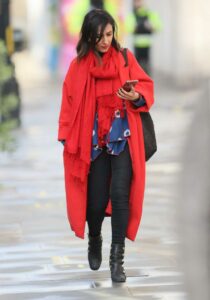 Anita Rani in a Bright Red Coat