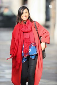 Anita Rani in a Bright Red Coat