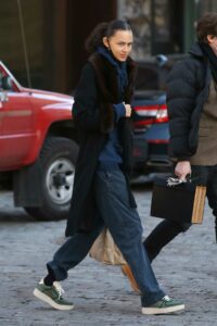 Binx Walton in a Black Coat