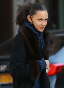 Binx Walton in a Black Coat