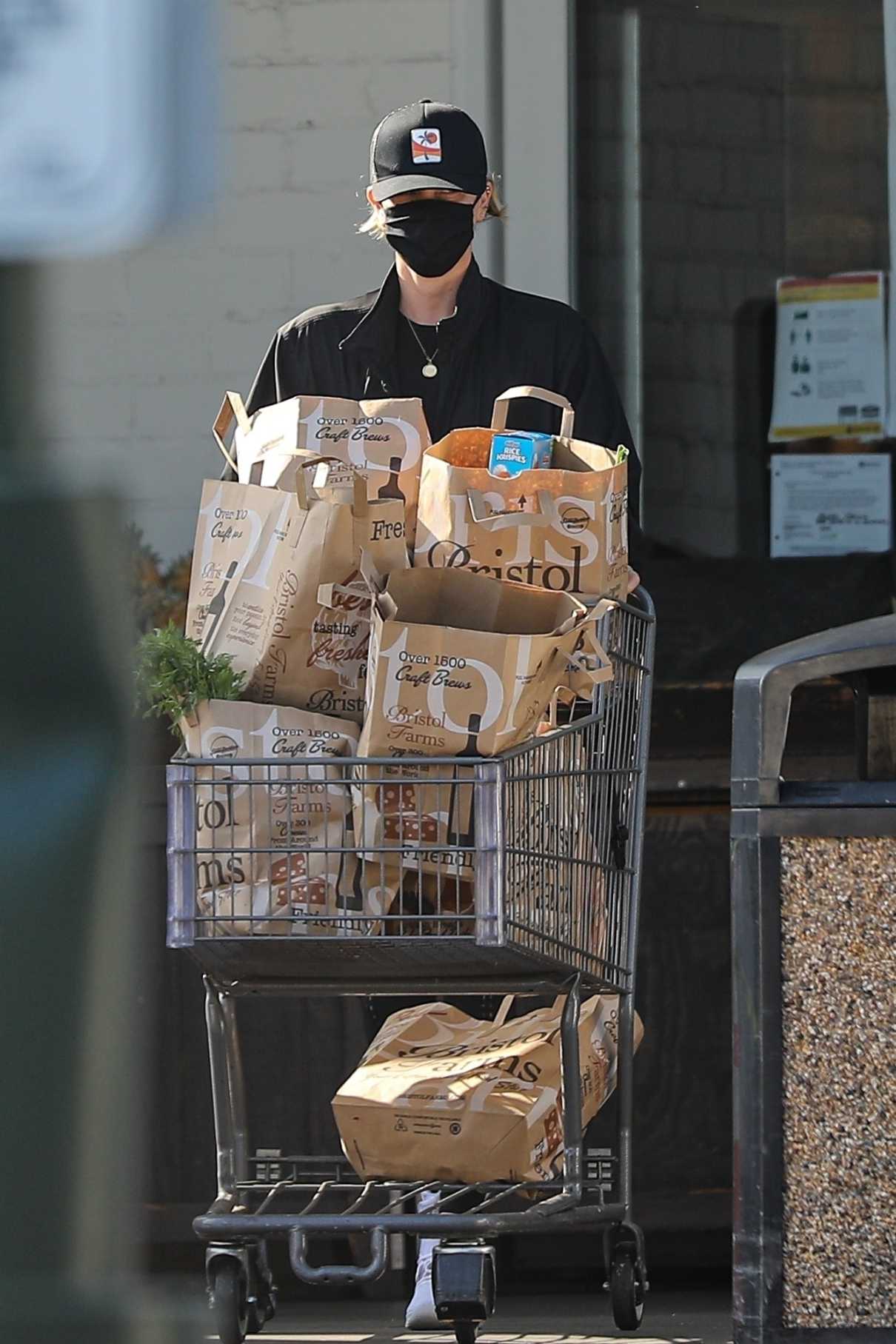 Charlize Theron in a Black Cap Stops by Bristol Farms for Groceries in ...