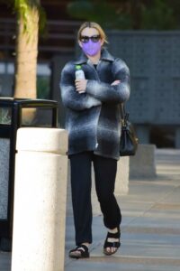 Emma Roberts in a Purple Protective Mask