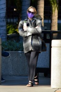 Emma Roberts in a Purple Protective Mask