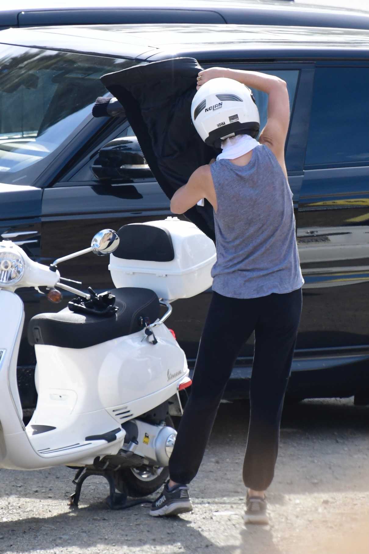 Gwyneth Paltrow in a Grey Tank Top Enjoys a Scooter Ride Out in Santa