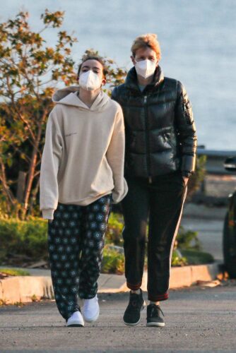 Laura Dern in a Black Puffer Jacket Enjoys a Walk with Her Daughter