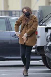 Lily Collins in a Tan Jacket