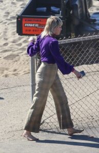Miley Cyrus in a Purple Blouse