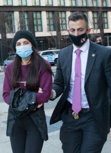 Miya Ponsetta in a Purple Sweatshirt