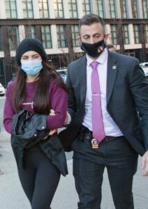 Miya Ponsetta in a Purple Sweatshirt