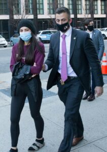 Miya Ponsetta in a Purple Sweatshirt