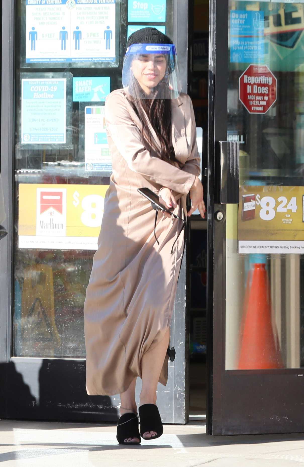 Miya Ponsetto in a Beige Trench Coat