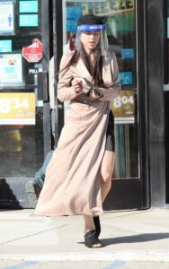 Miya Ponsetto in a Beige Trench Coat