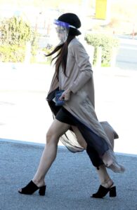 Miya Ponsetto in a Beige Trench Coat