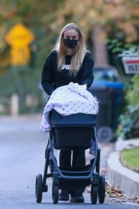 Sophie Turner in a Black Puma