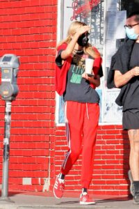 Stella Maxwell in a Red Adidas Track Pants