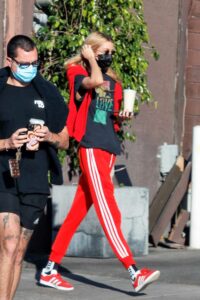 Stella Maxwell in a Red Adidas Track Pants