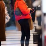 Tayshia Adams in a Red Beanie Hat Goes Shopping at Nike Store with a Friend in New York 01/08/2021