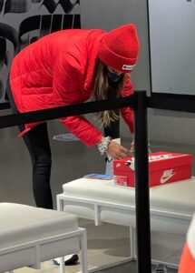 Tayshia Adams in a Red Beanie Hat