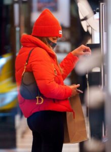 Tayshia Adams in a Red Beanie Hat