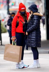 Tayshia Adams in a Red Beanie Hat