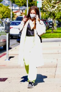 Addison Rae in a White Trench Coat