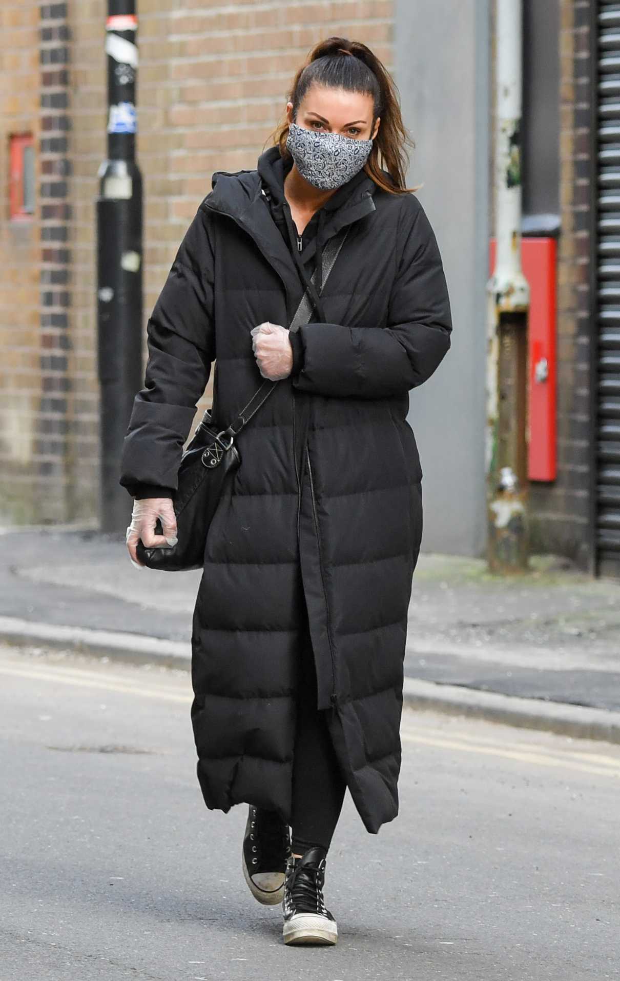 Alison King in a Black Puffer Coat