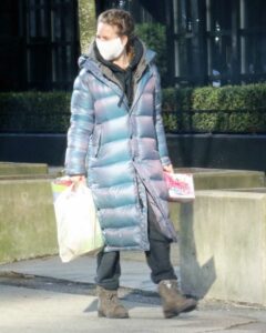 Britt Robertson in a Grey Puffer Coat