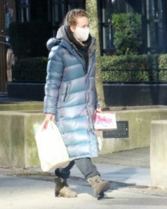 Britt Robertson in a Grey Puffer Coat